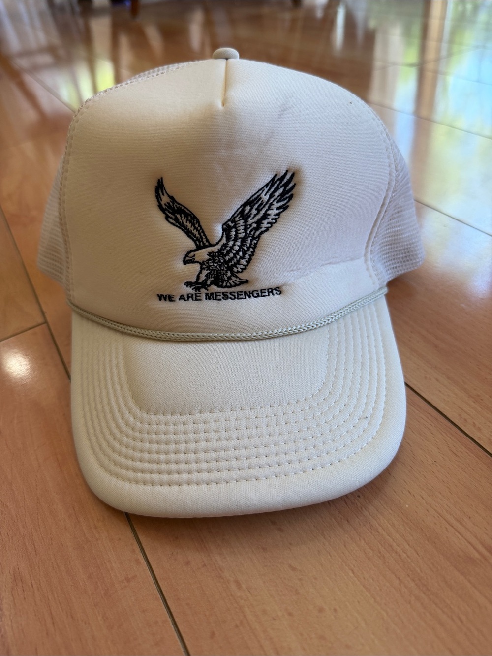 Off White Trucker Cap with Black Eagle Patch - We Are Messengers